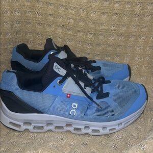 On Running Blue and Black Athletic Shoes